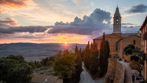 Sunset in Pienza with a view of the rolling hills of Val d'Orcia.