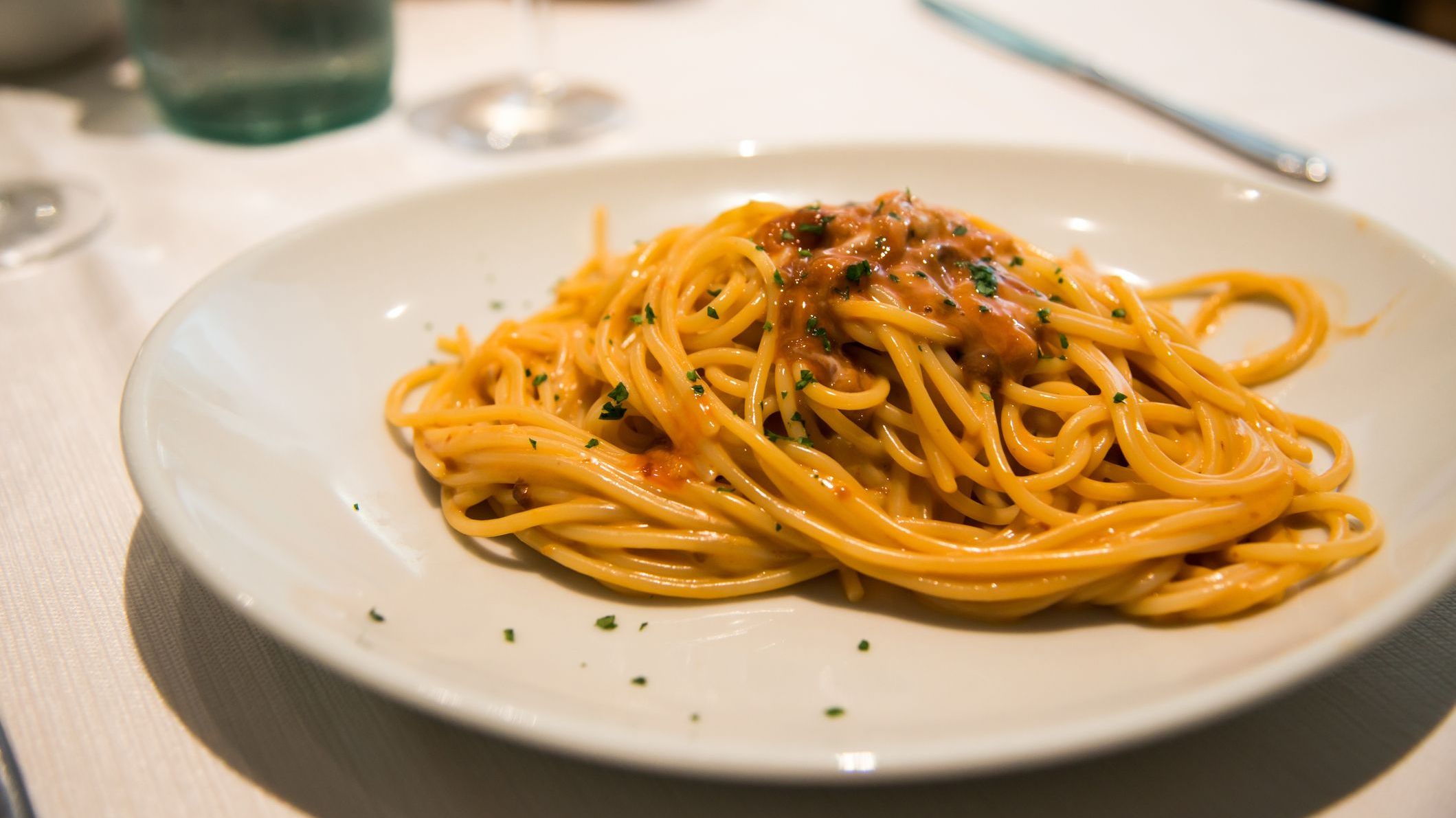 Spaghetti with urchin on a white plate. 