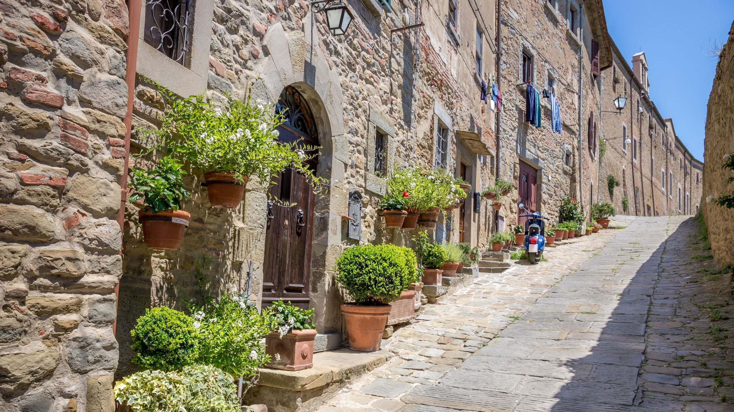 A picturesque street in Cortona, one of the must-see places in Tuscany.
