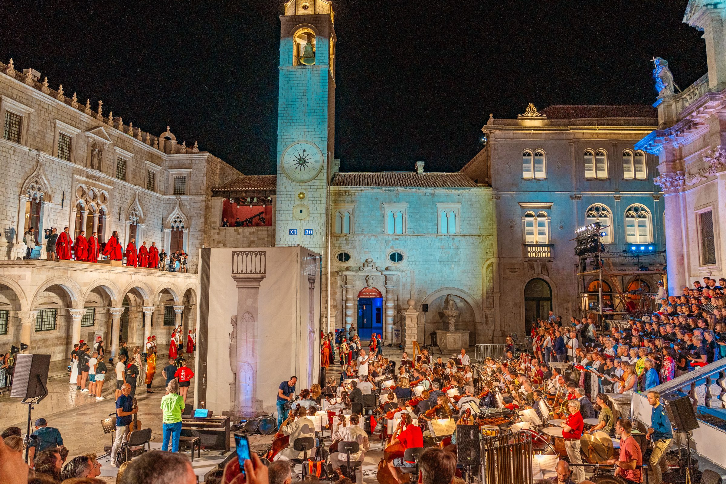 A concert in an illuminated square. 