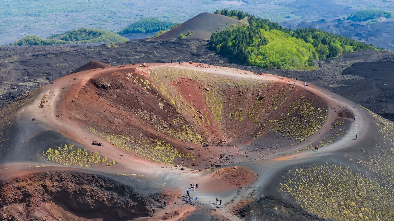An aerial view of the Silvestri crater at the slopes of Mount Etna, one of the must-visit places in Sicily. 