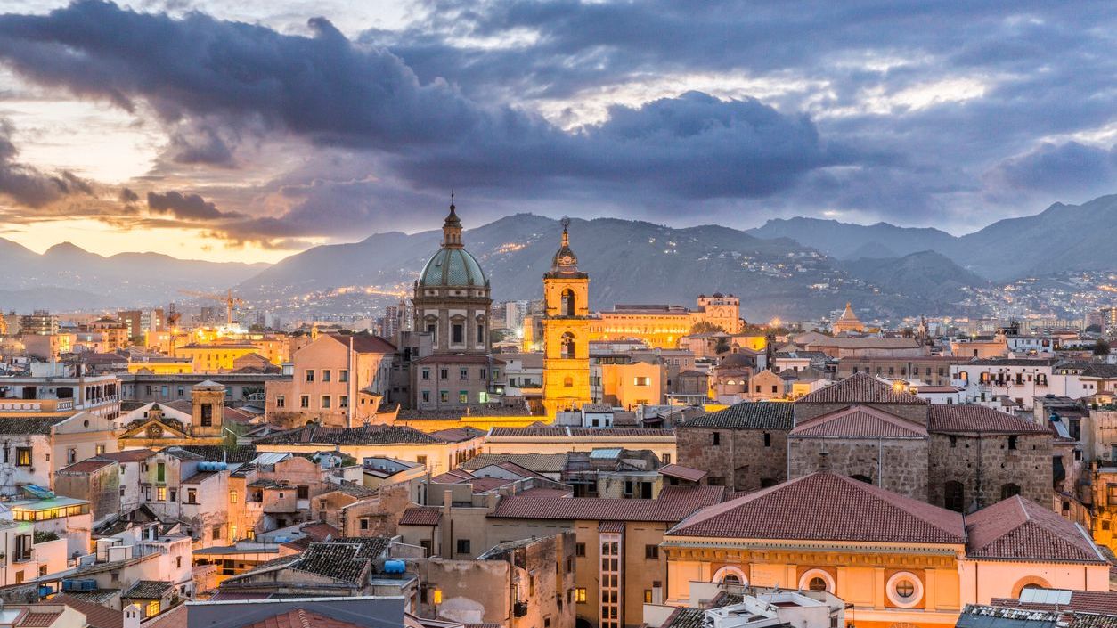 A panoramic view of Palermo's rooftops in the blue hour. 