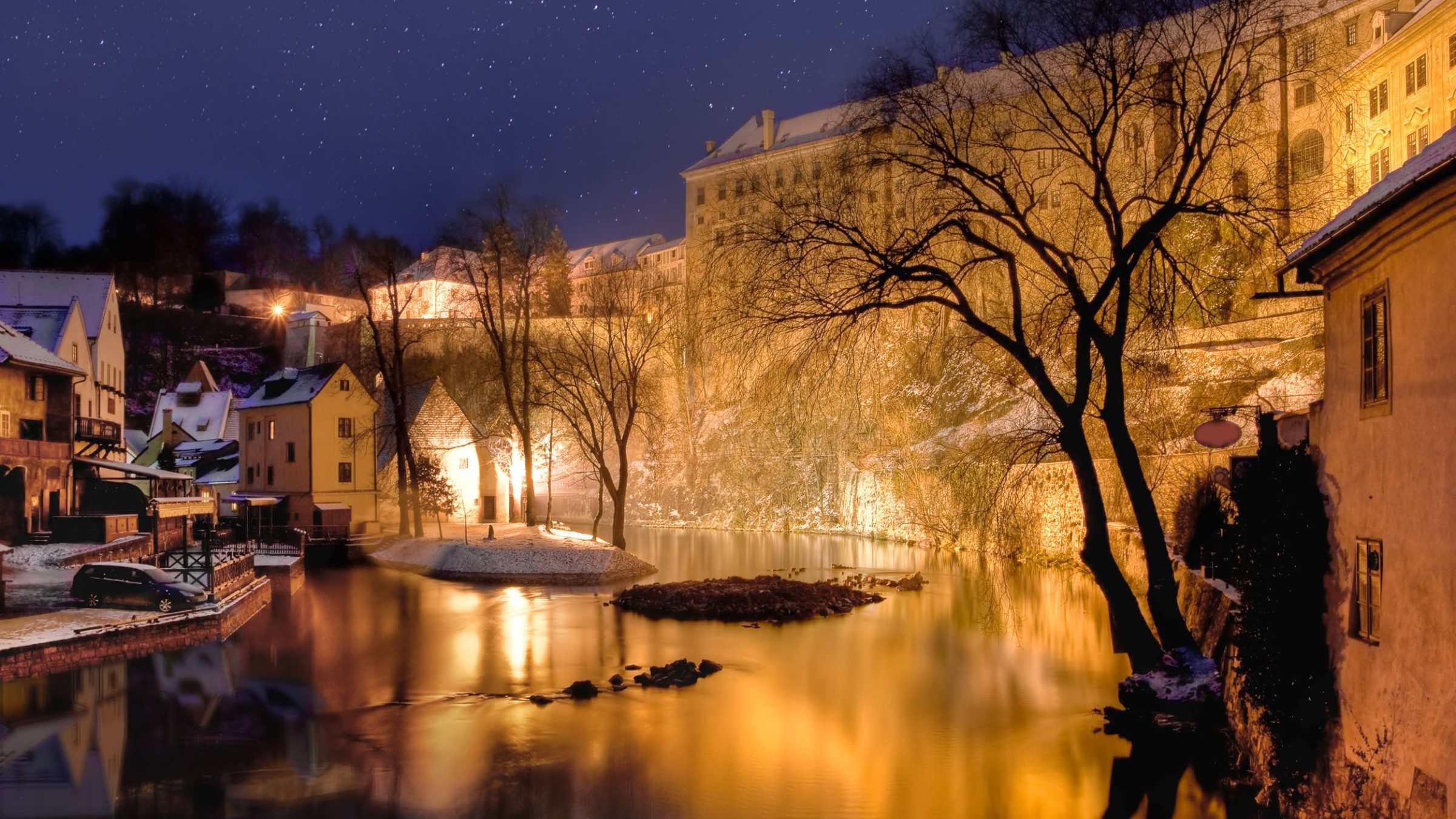 A night shot of the beautiful architecture in Cesky Krumlov under the snow. For many, winter is the best time to visit the Czech Republic.