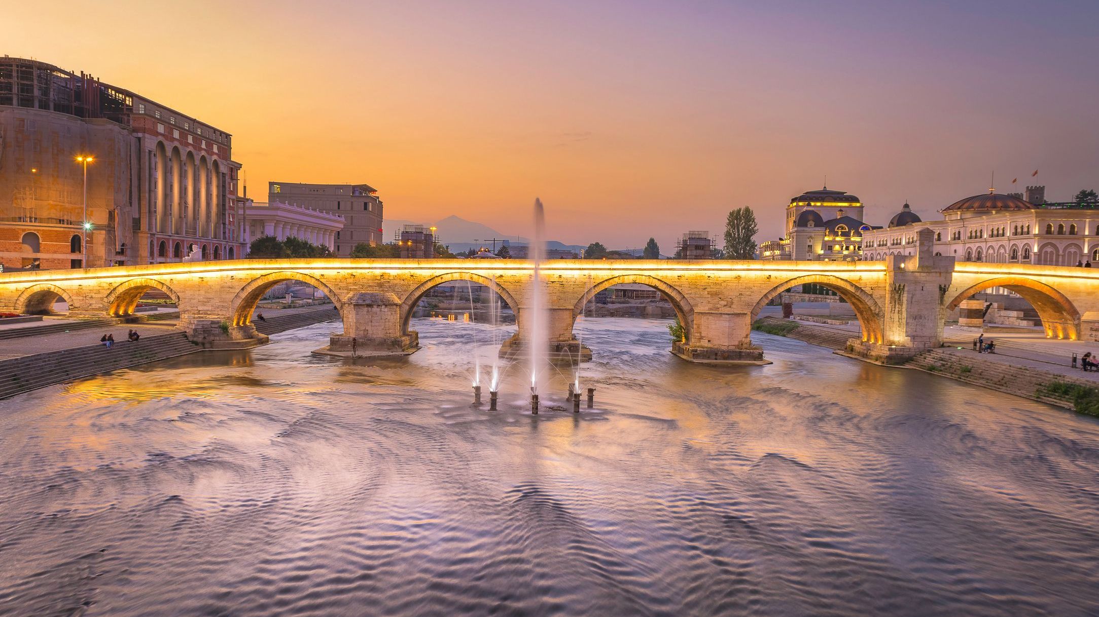 A beautifully lit bridge in Skopje at sunset. 