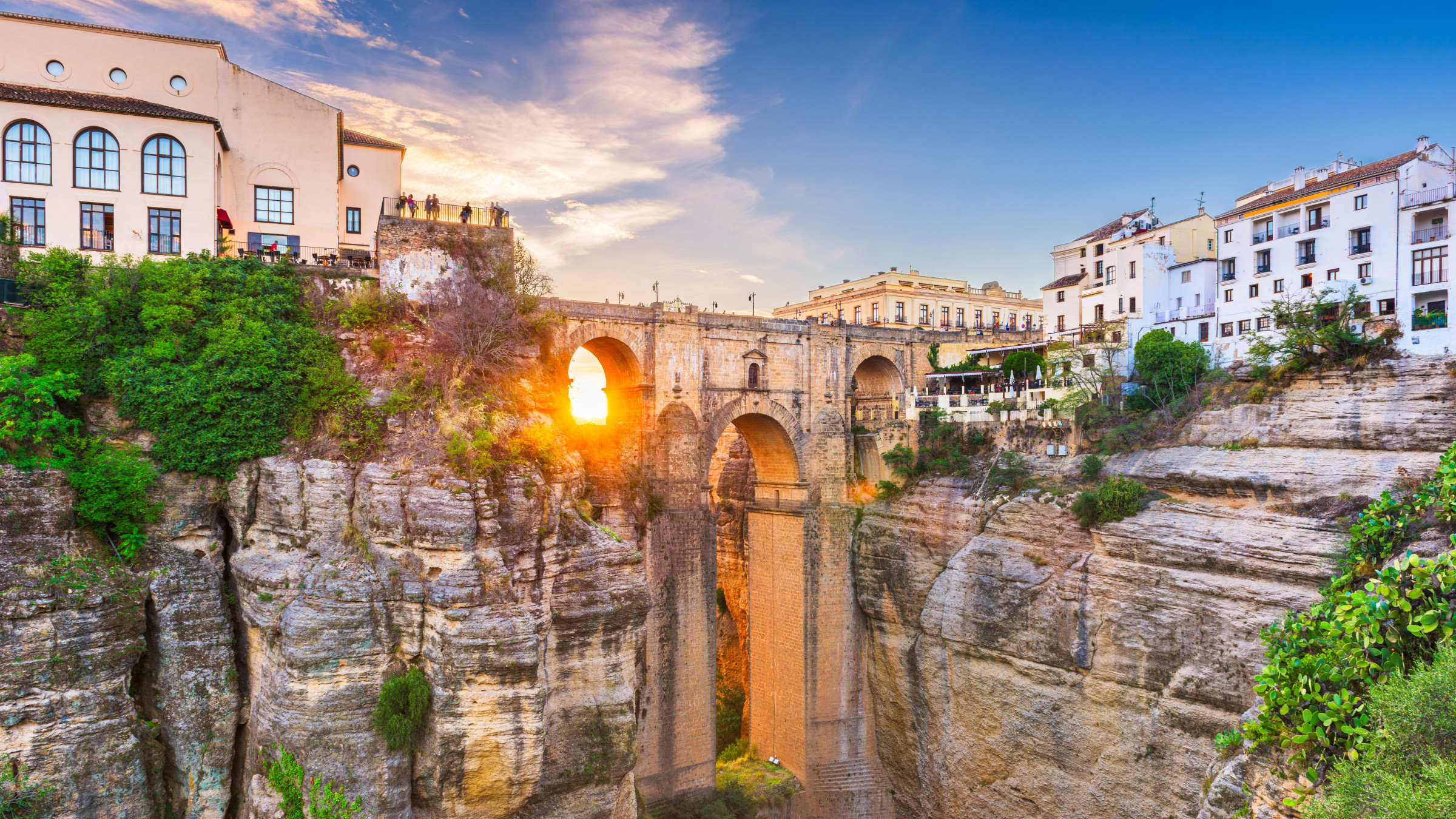 A majestic bridge joining the two parts of a town built over a ravine.