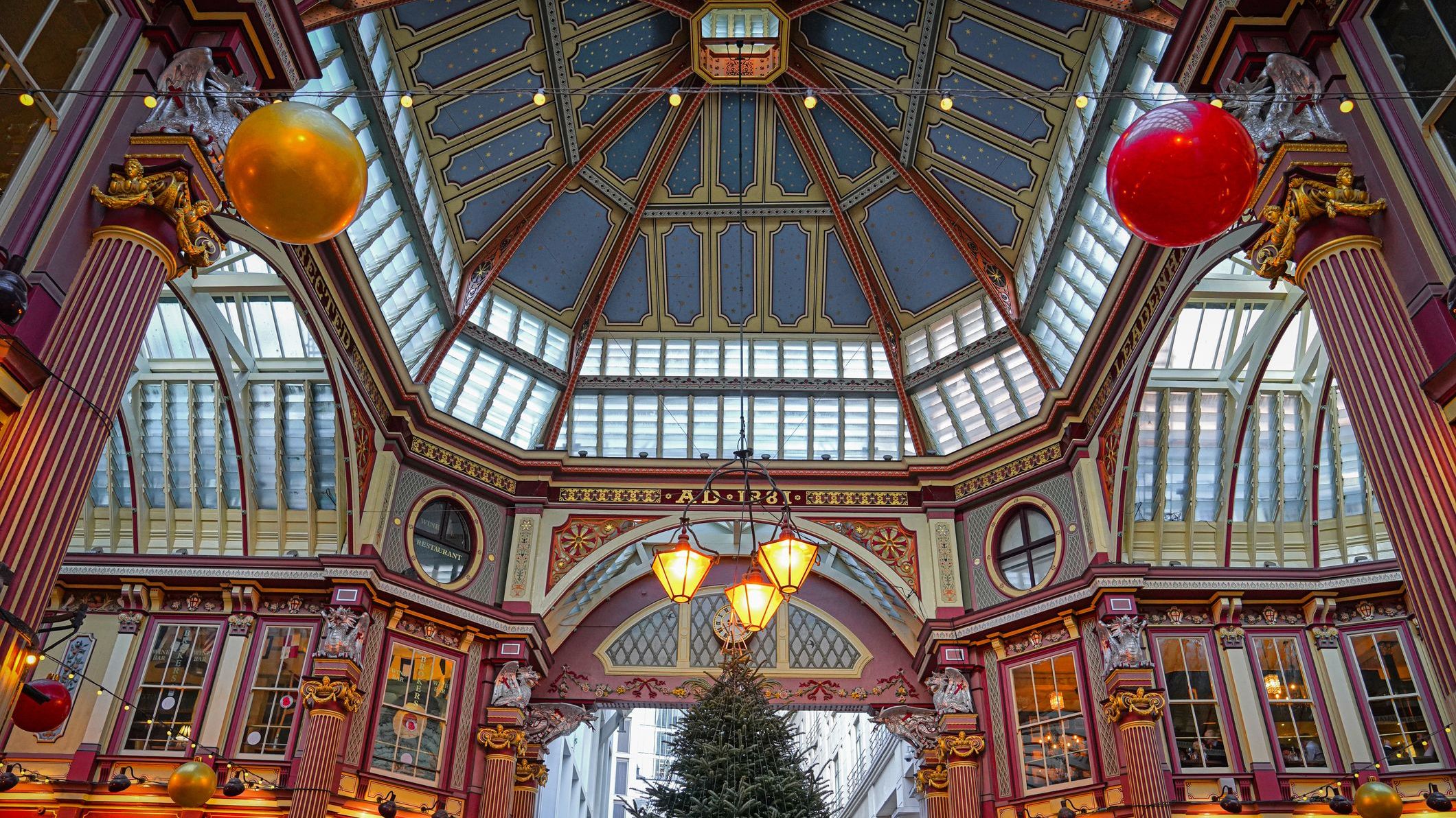 Leadenhall Market at Christmas, London, United Kingdom. There's a Christmas tree and other festive decorations.