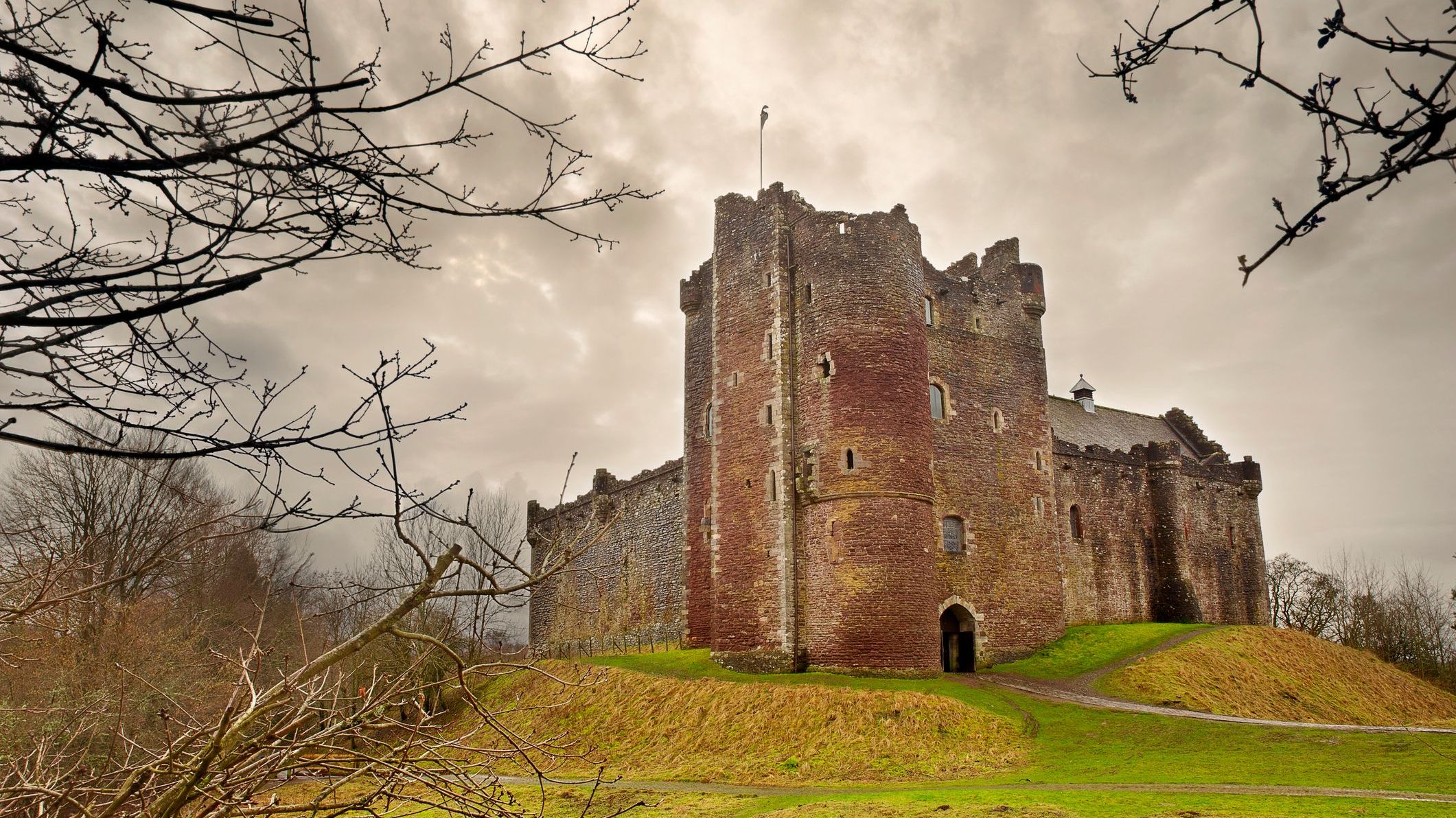 Doune Castle, Scotland under a misty sky. 