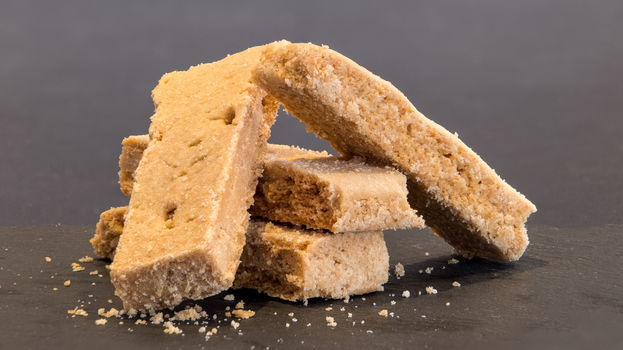 A close-up of four Scottish shortbread cookies. 